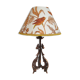Rock-style table lamp with its vintage bird pattern shade