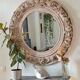 Round mirror with floral patterns
