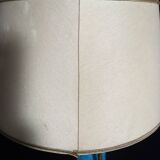 Large table lamp with earthenware peacock and beige silk lampshade