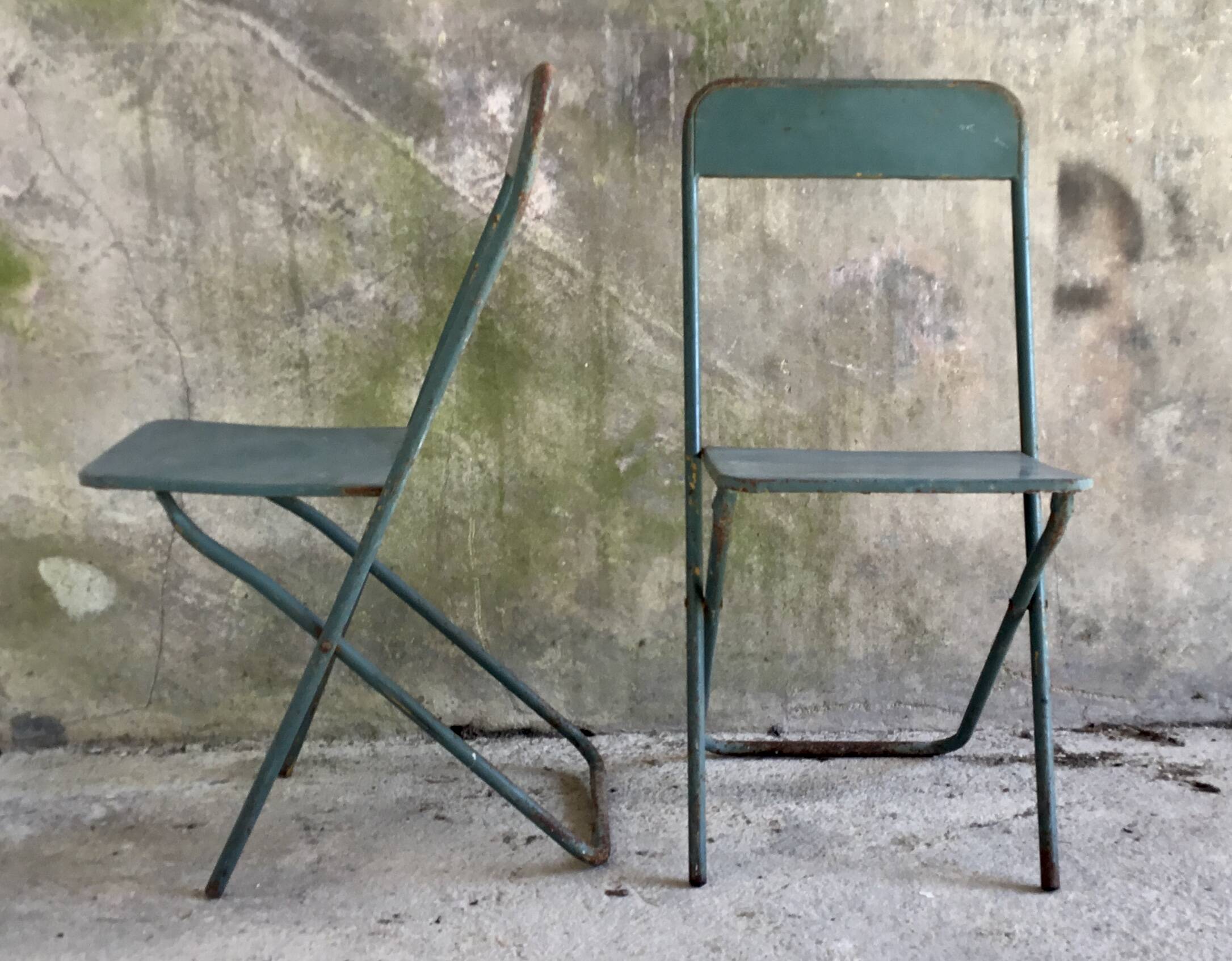 Pair of folding metal chairs, military or industrial, mid-20th century.