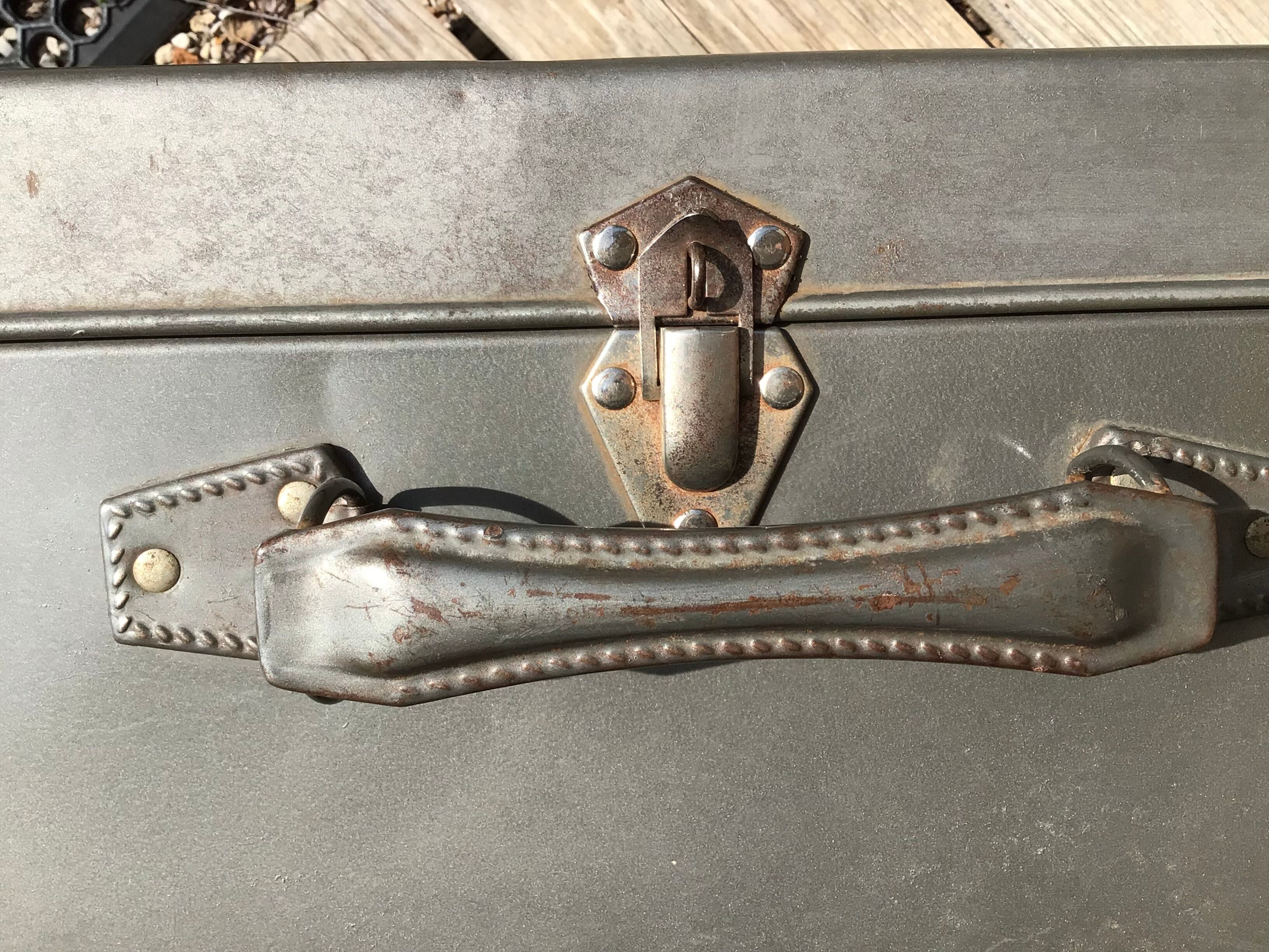 Vintage dark grey metal suitcase