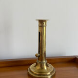 Old brass push candle holder