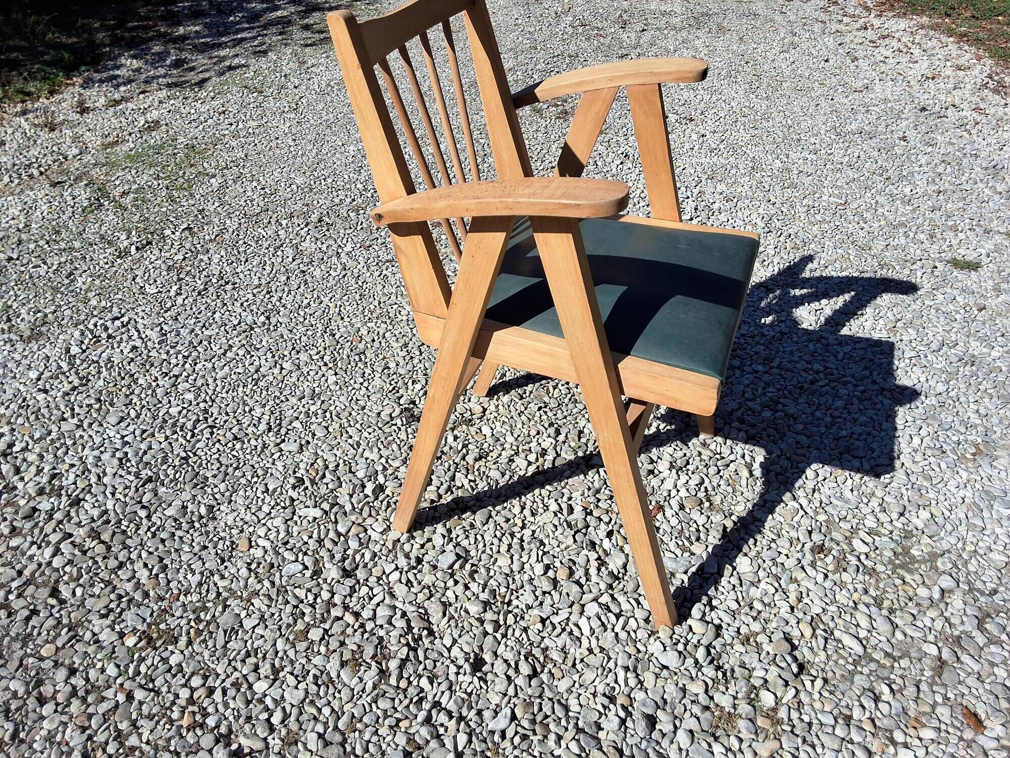 Compass leg armchair