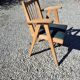 Compass leg armchair