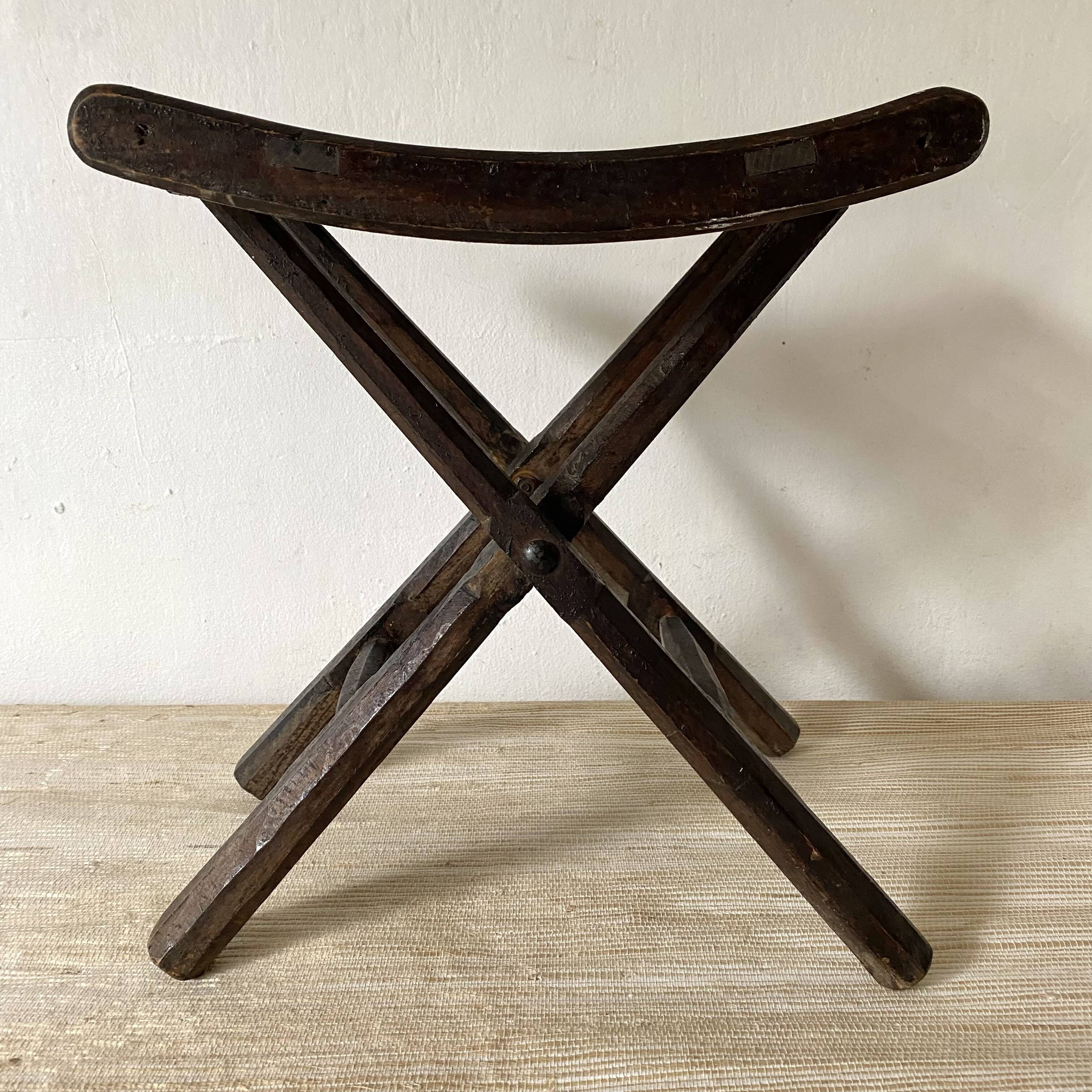 Folding slatted wooden stool