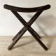 Folding slatted wooden stool