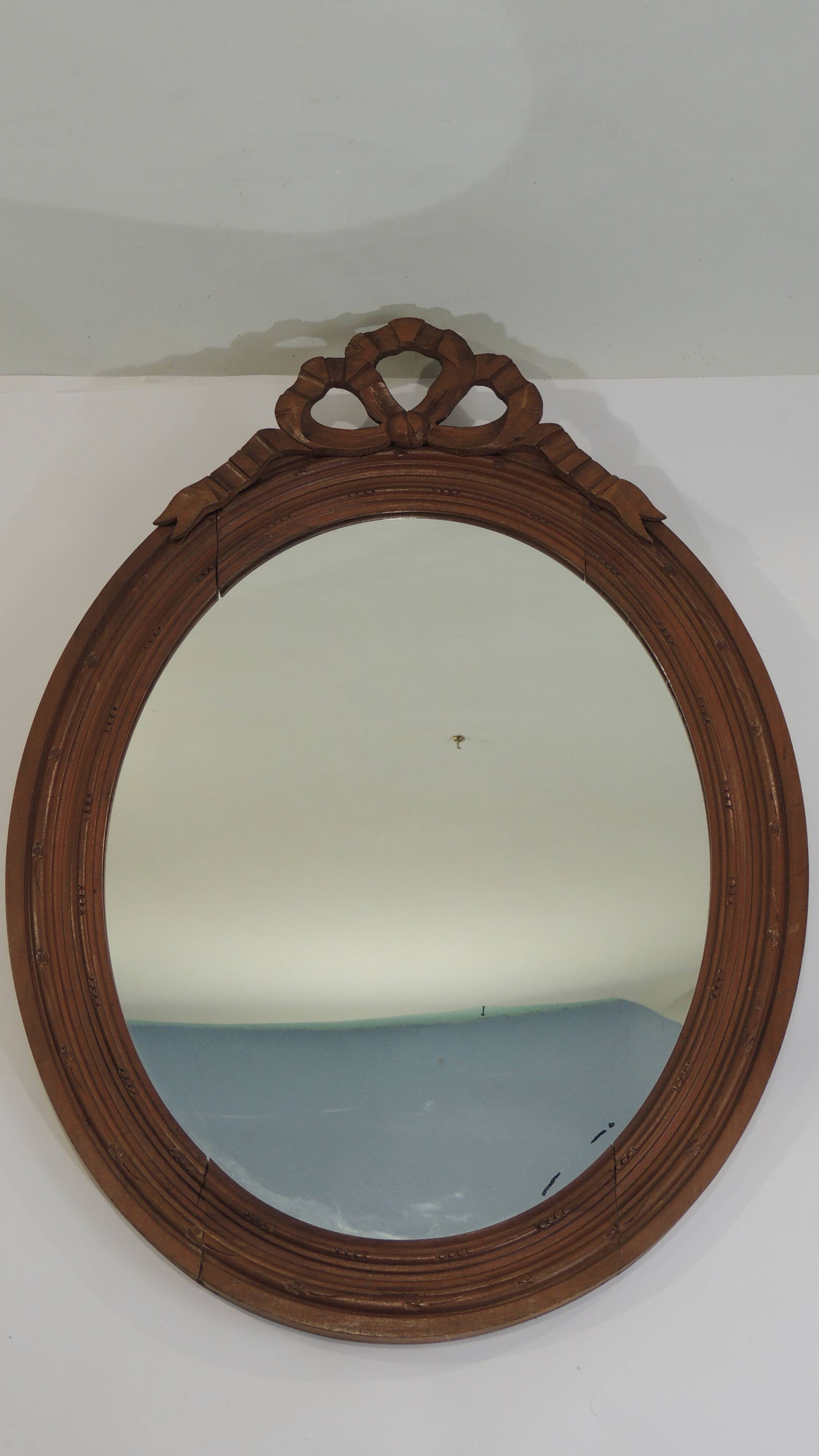 Antique oval mirror in carved wood – Louis XVI style, ribbon bow decoration, mid