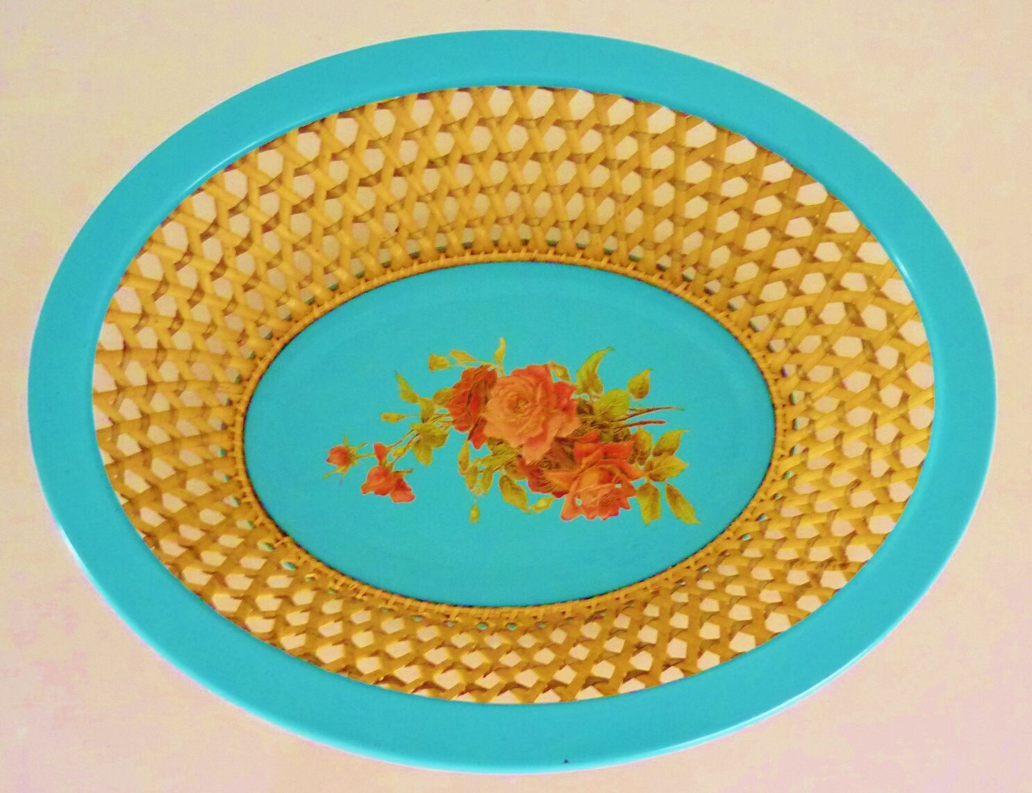 Antique basket in painted sheet metal and woven wicker, decorated with roses