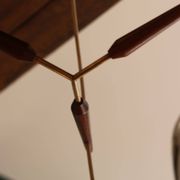 Scandinavian chandelier "Cascade" from the 1960s in brass, teak, and smoked glass.