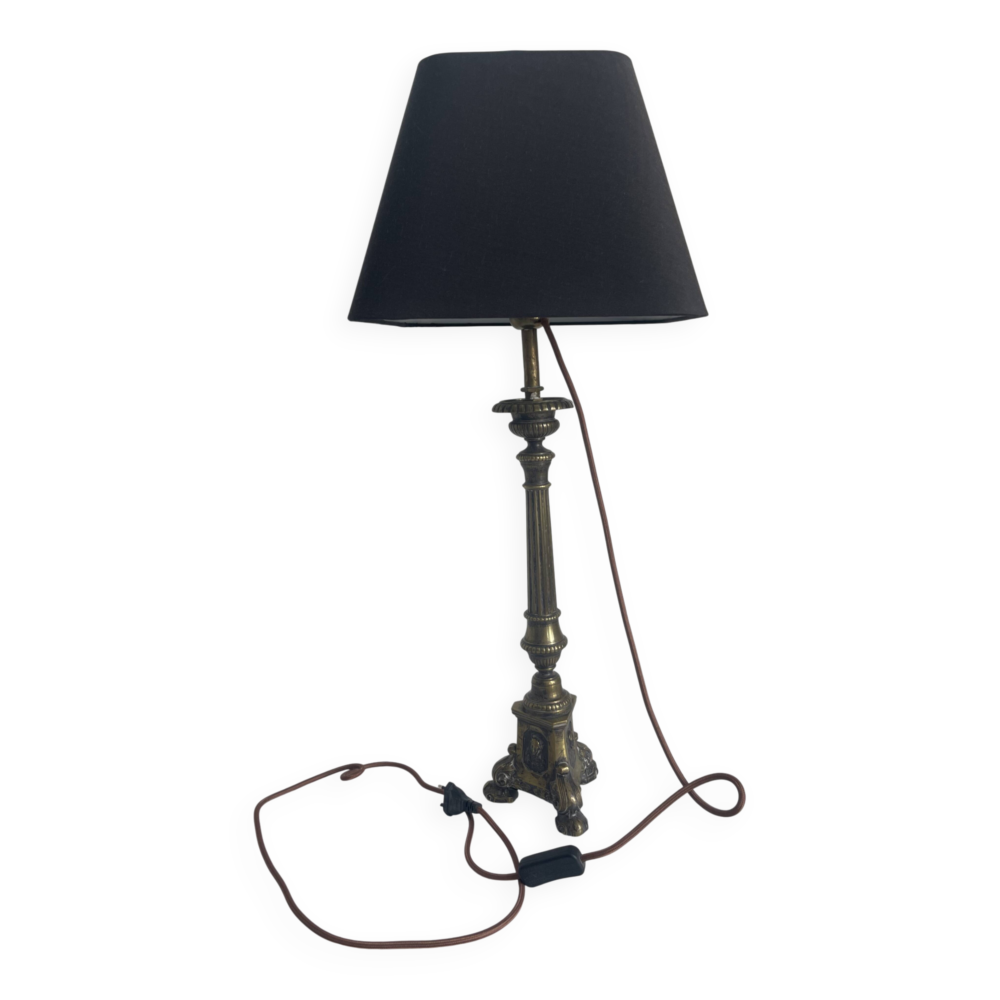 Old candle holder transformed into a lamp.