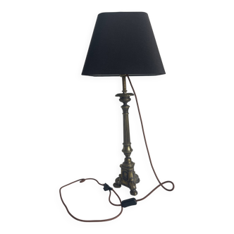 Old candle holder transformed into a lamp.