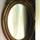 Golden Oval Mirror with Bow and Roses Decor