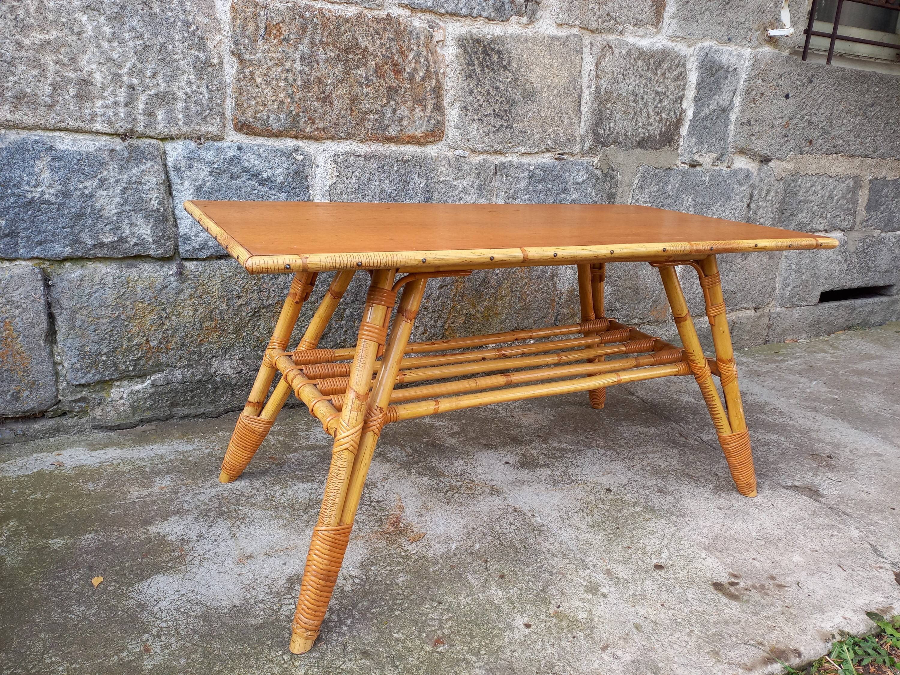 Rattan coffee table with compass legs
