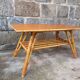 Rattan coffee table with compass legs