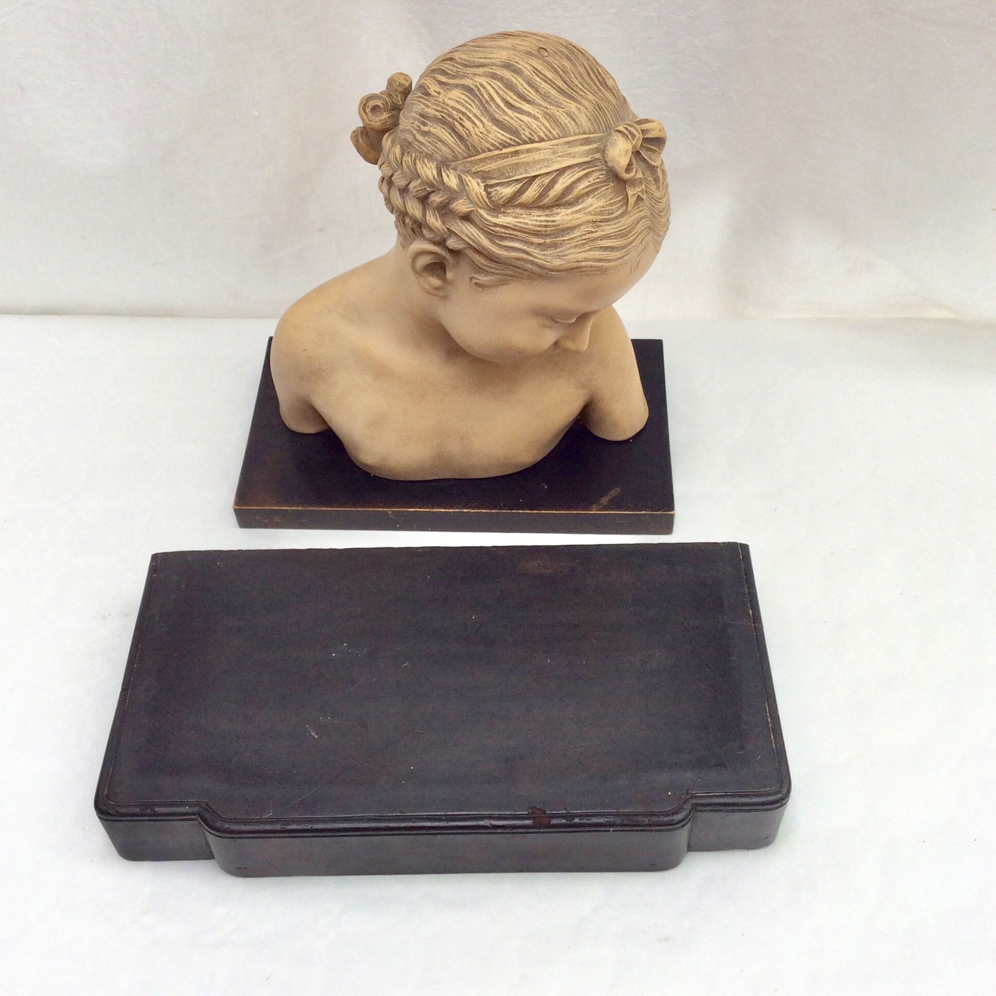Girl's head in terracotta numbered
