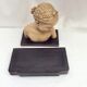 Girl's head in terracotta numbered