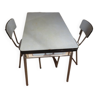 Set of a vintage designer Formica table from the 50s/60s accompanied by 2 chairs.