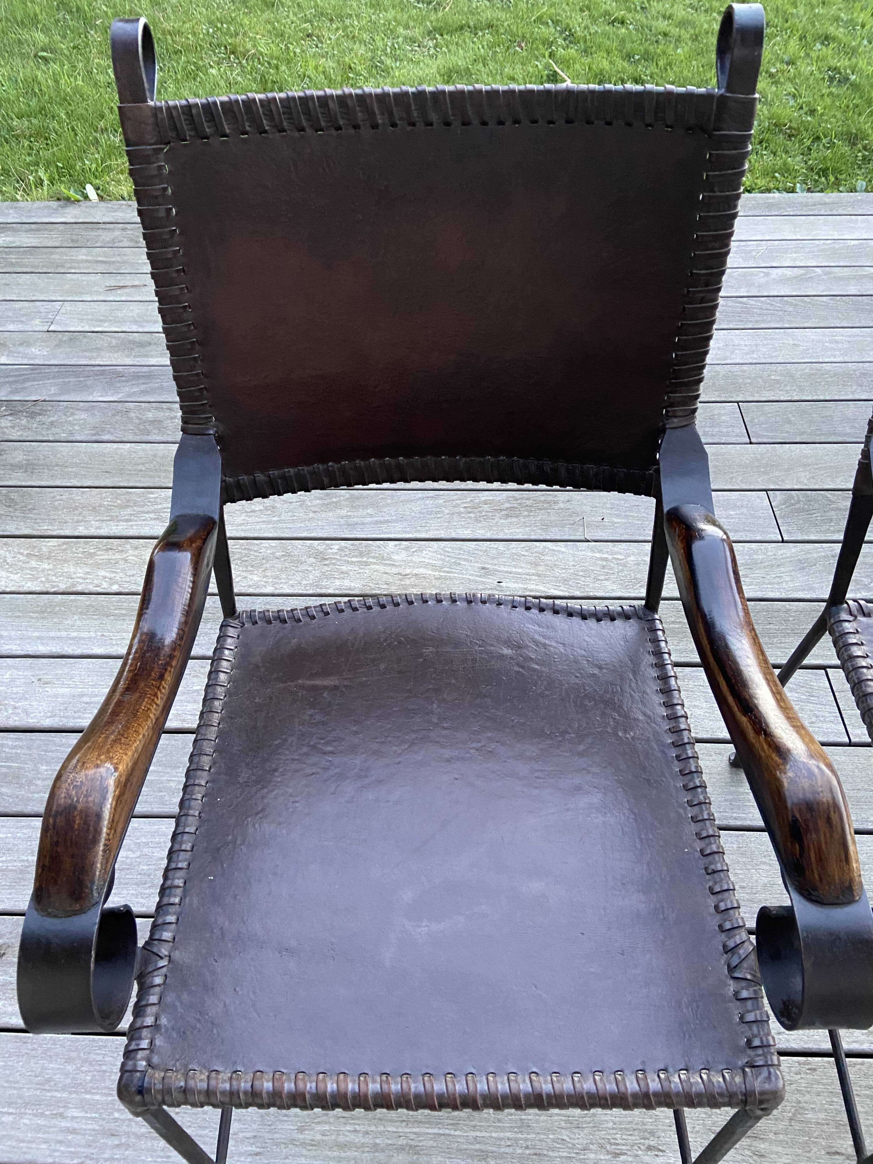 Pair of wrought iron armchairs