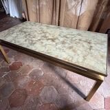 Brass coffee table with shaded lacquer top