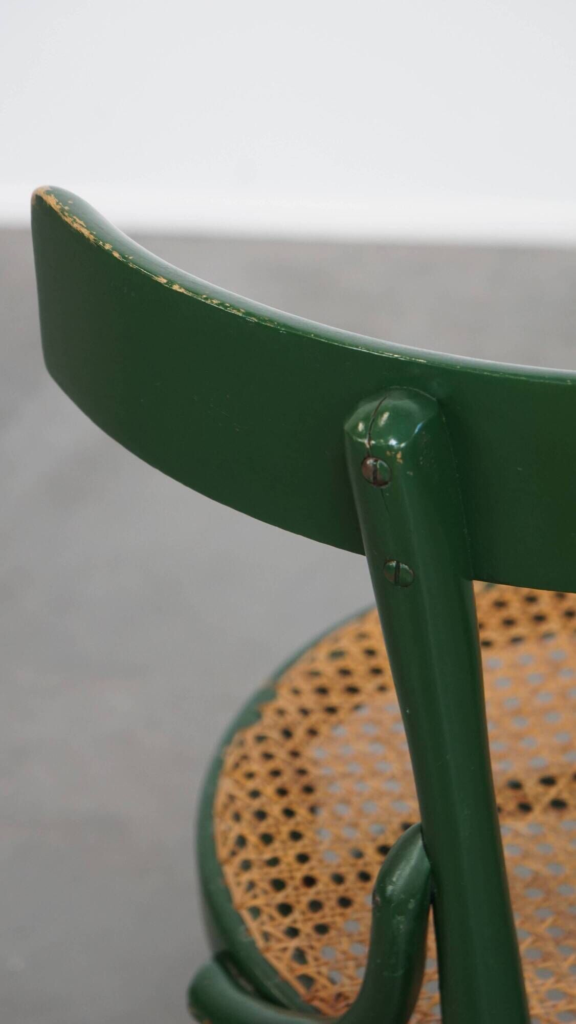 Vintage green bistro chair with woven reed seat