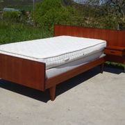 Vintage bed in teak with integrated bedside table.