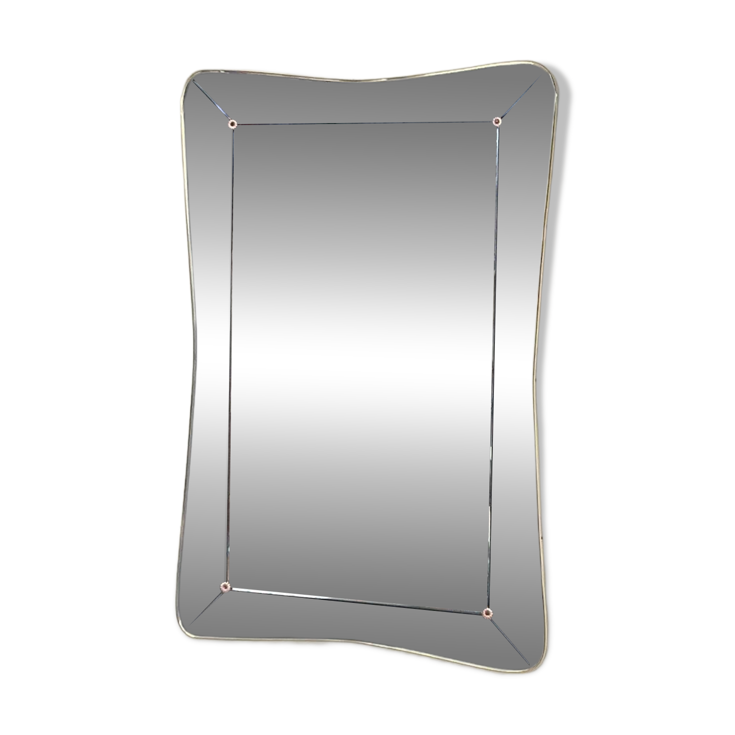 1950s double-thickness wall mirror with brass profile and supports.