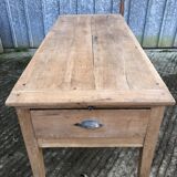 Antique solid cherry farmhouse table with 3 drawers and 1 pull out.