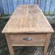 Antique solid cherry farmhouse table with 3 drawers and 1 pull out.