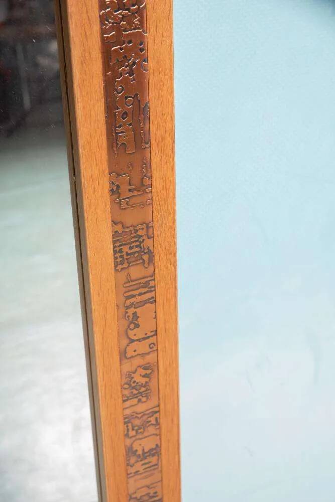 Vintage Danish wall mirror design from the 1960s in oak and stamped brass.