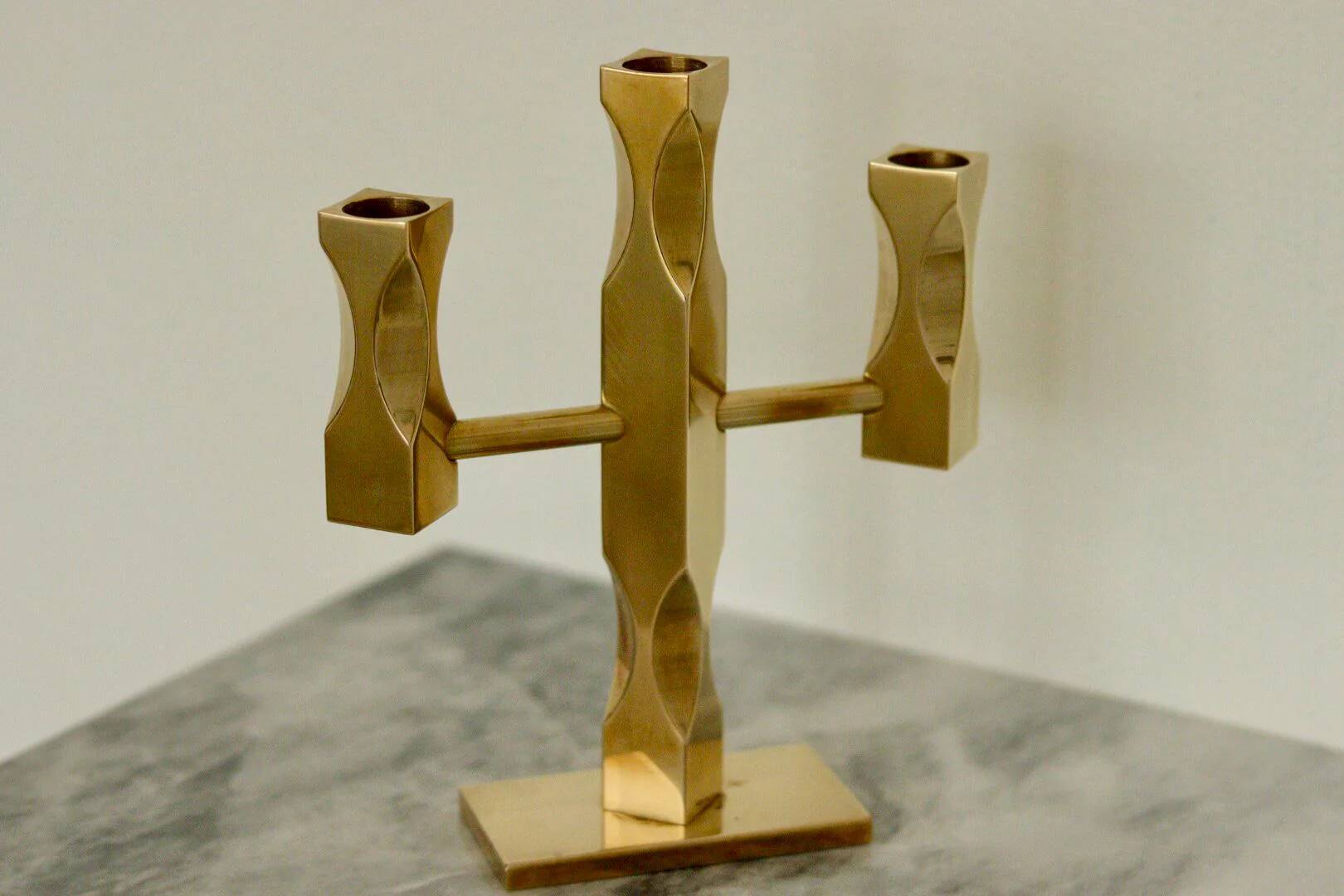 Swedish three-armed candelabrum in brass by Lars Åkesson for Vallonmässing