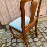 Vintage Louis XV chair made of carved solid wood with blue velvet fabric.