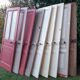 Eight old communication doors, solid and glazed, made of solid wood.