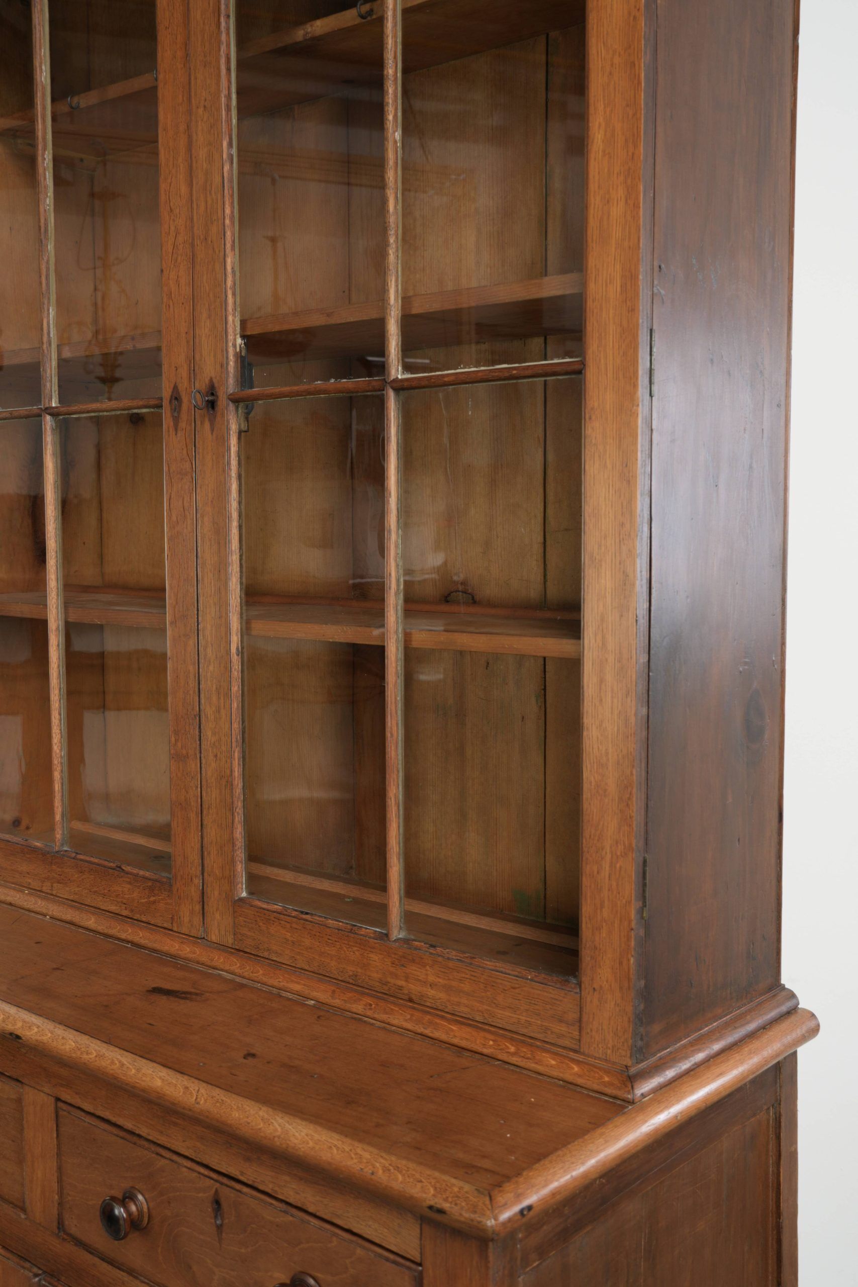 Antique English oak buffet/bookcase from 19th century with original glass