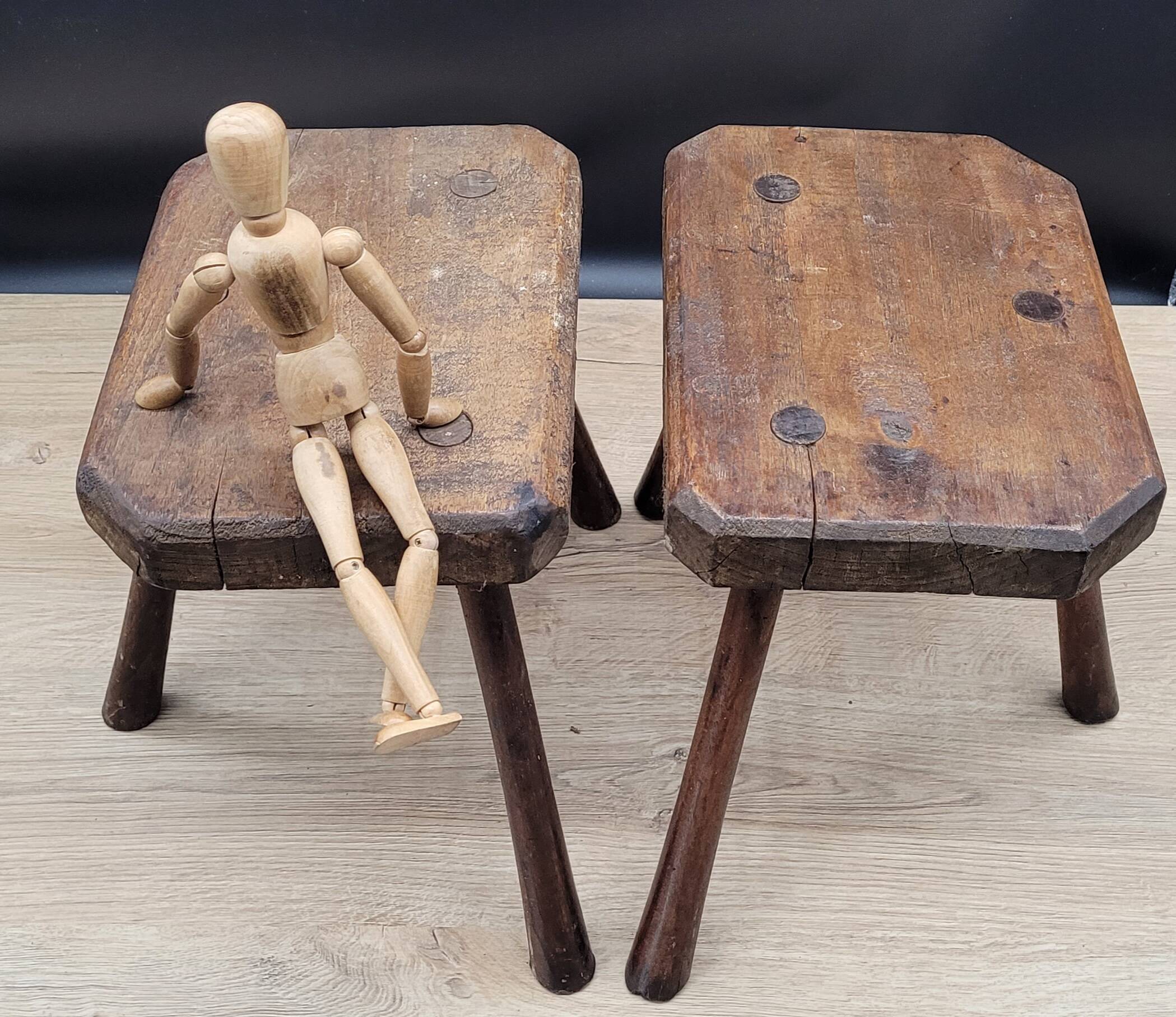 Pair of solid octagon cowhide tripod stools