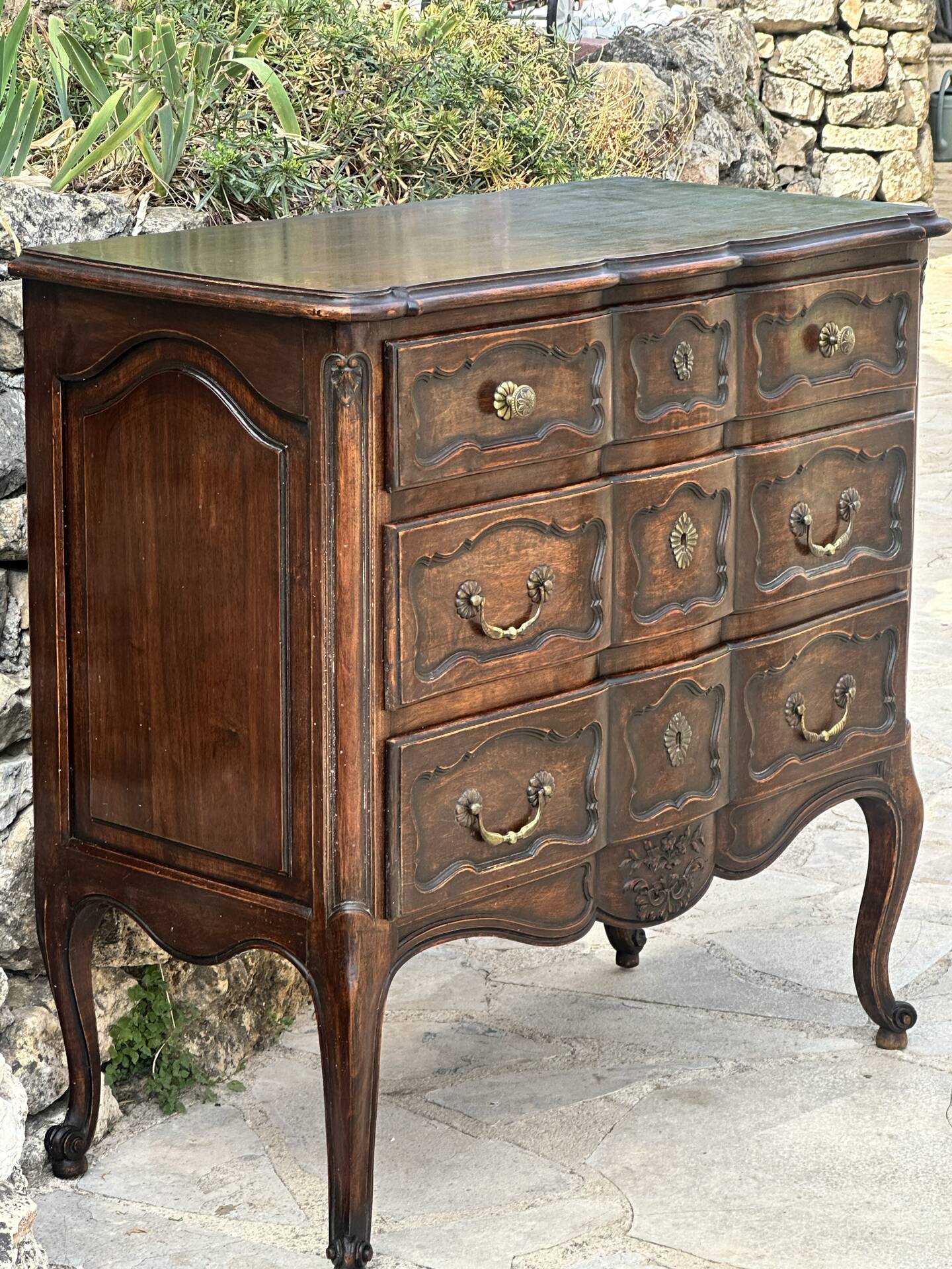 Carved and moulded solid wood commode in the Louis XV style.