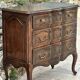 Carved and moulded solid wood commode in the Louis XV style.