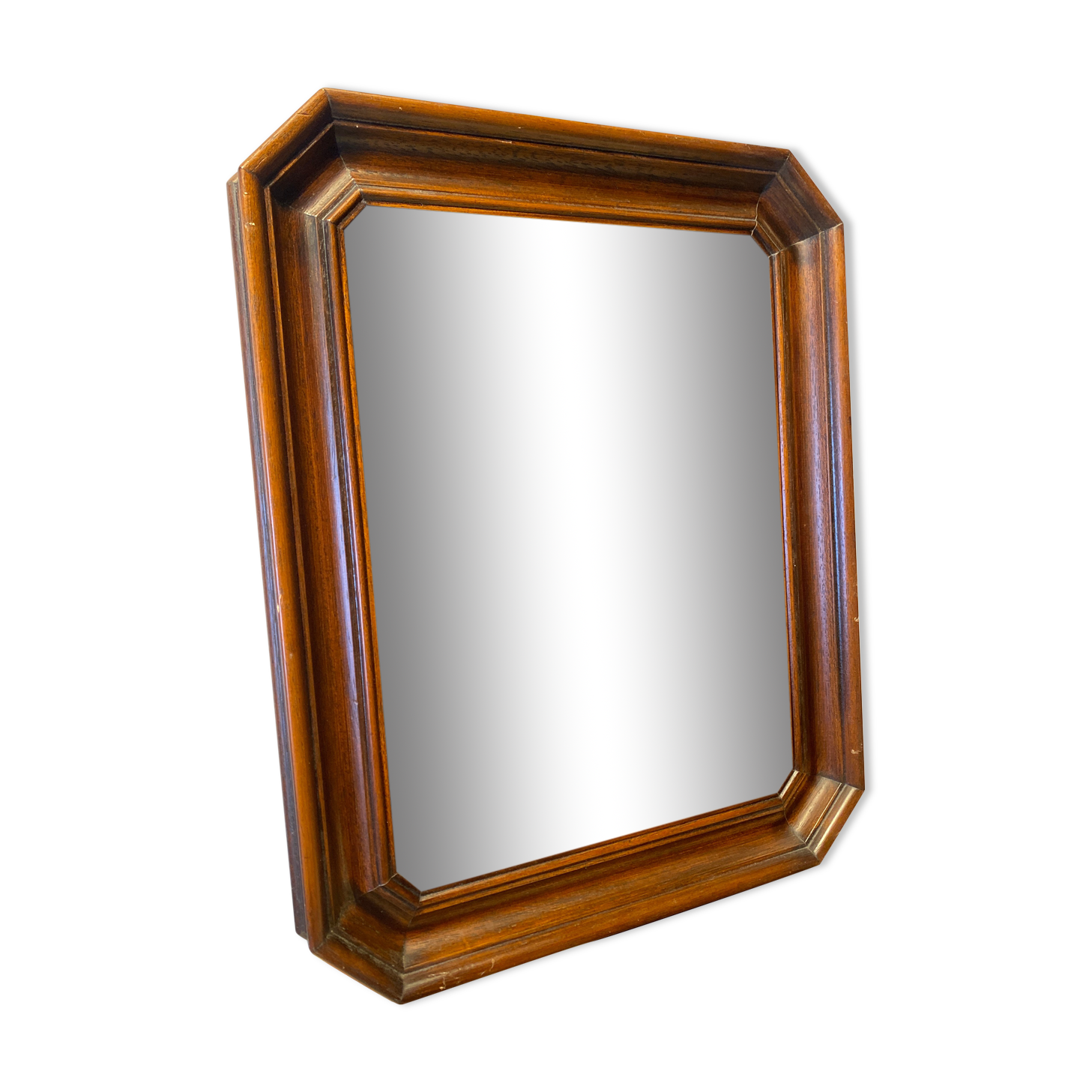 Beveled mirror in its wooden frame