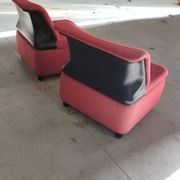 Pair of lounge chairs in red tweed and black vinyl