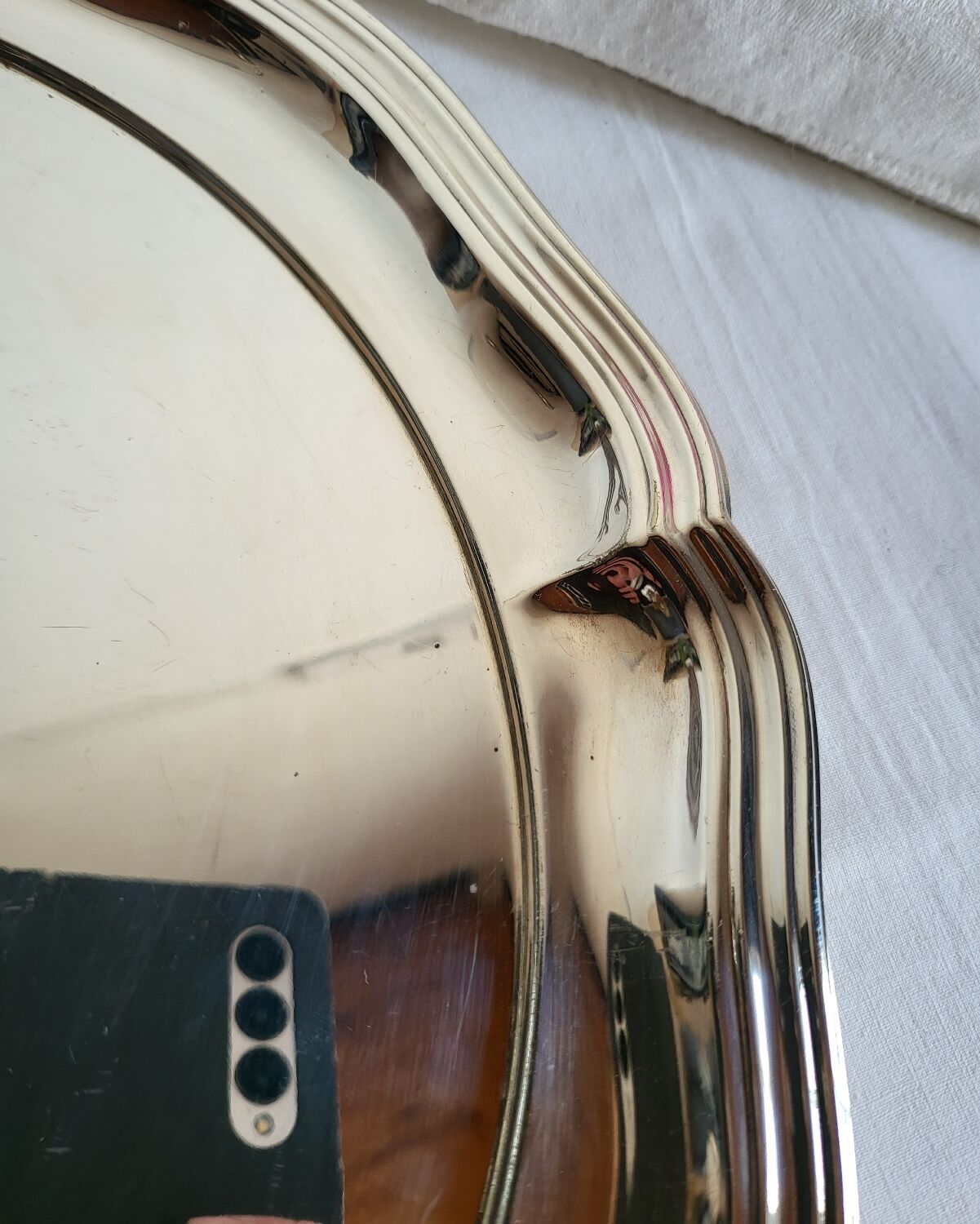 Round silver-plated serving dish with a glass base.