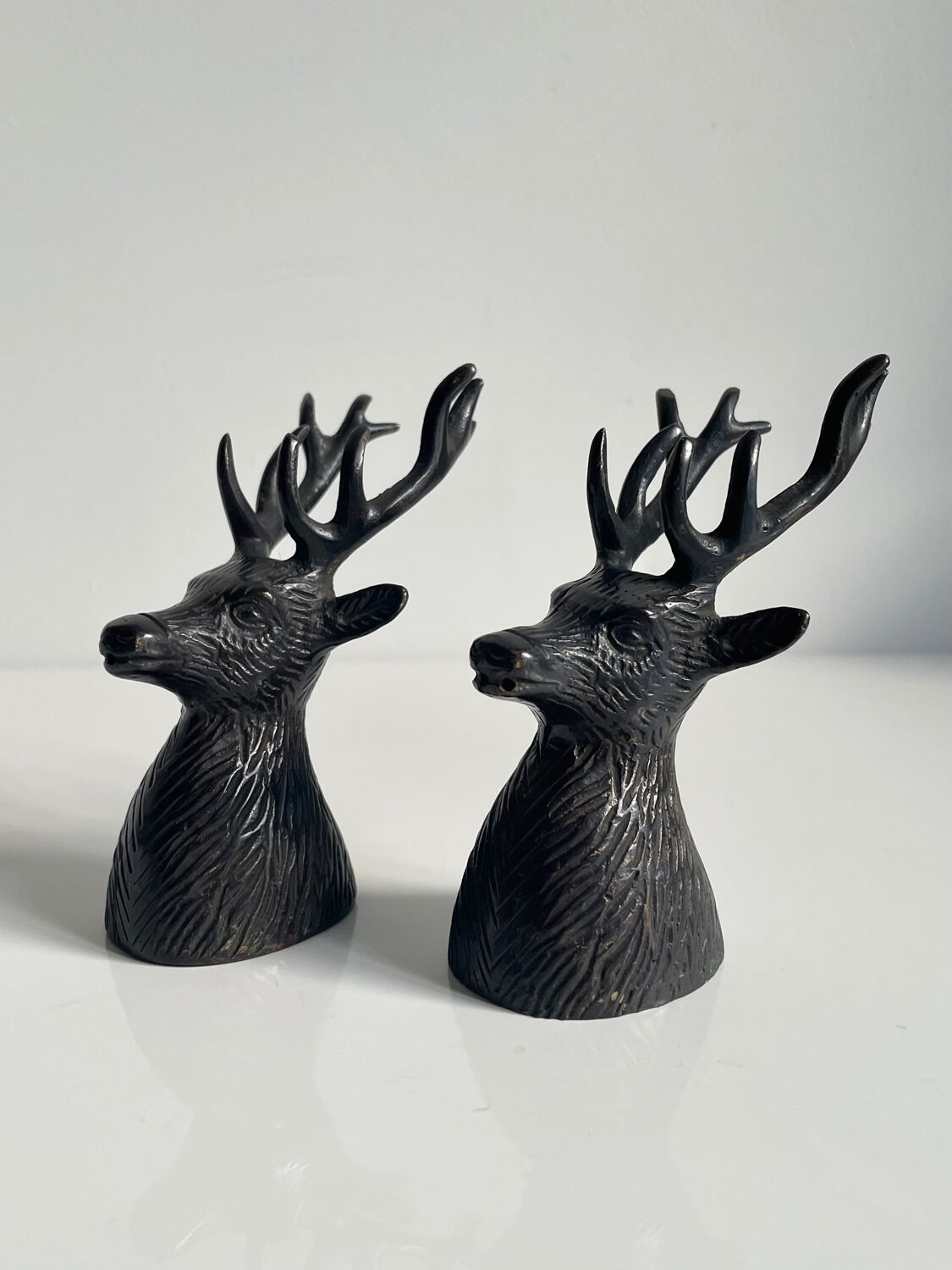 Salt and pepper shaker set with patinated brass deer heads.