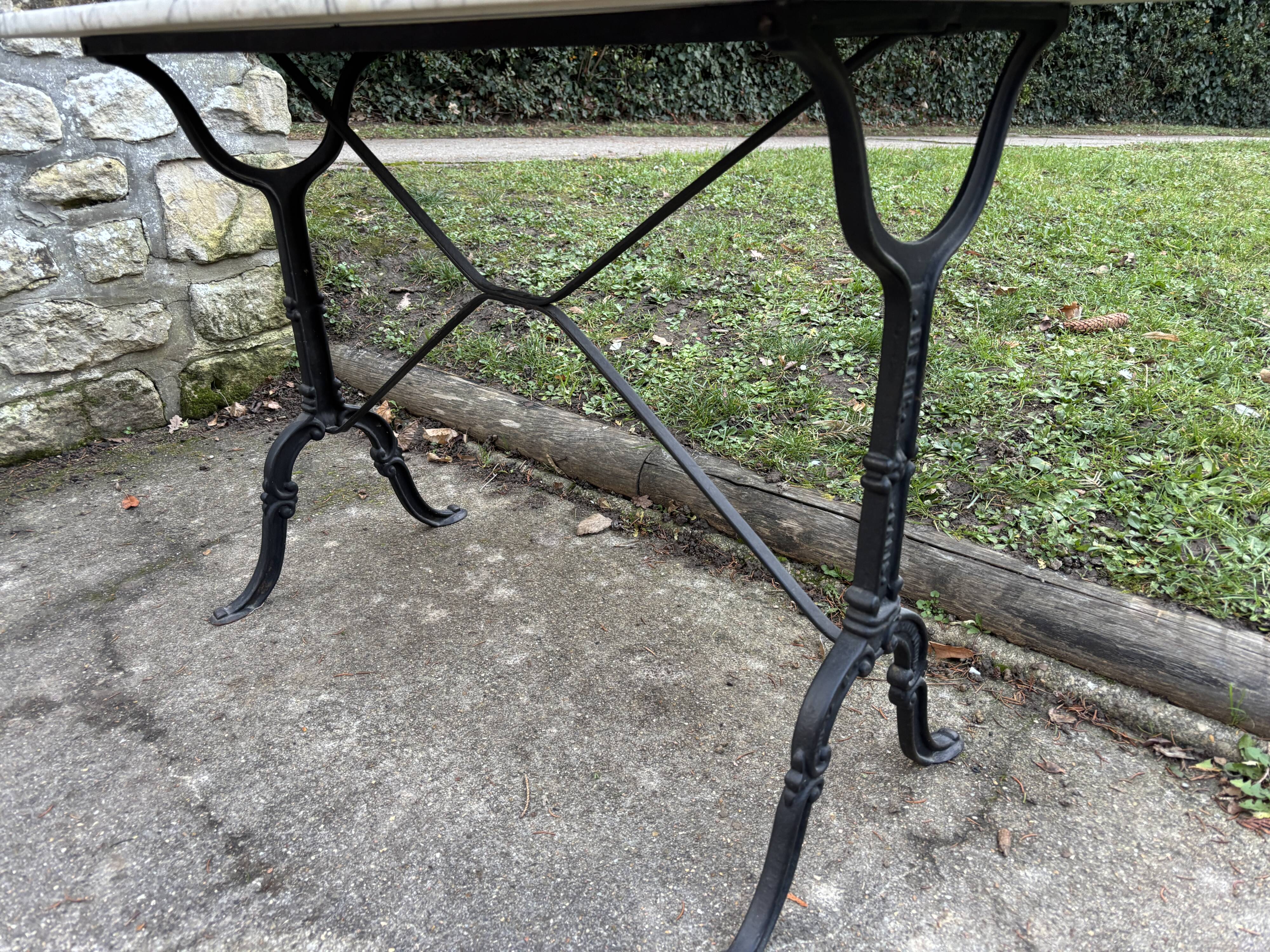 Old bistro table by Berc in Paris. Wrought iron, marble top.