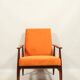Modern armchair in orange papaya velvet with dark brown wood, 1970s Scandinavian style.