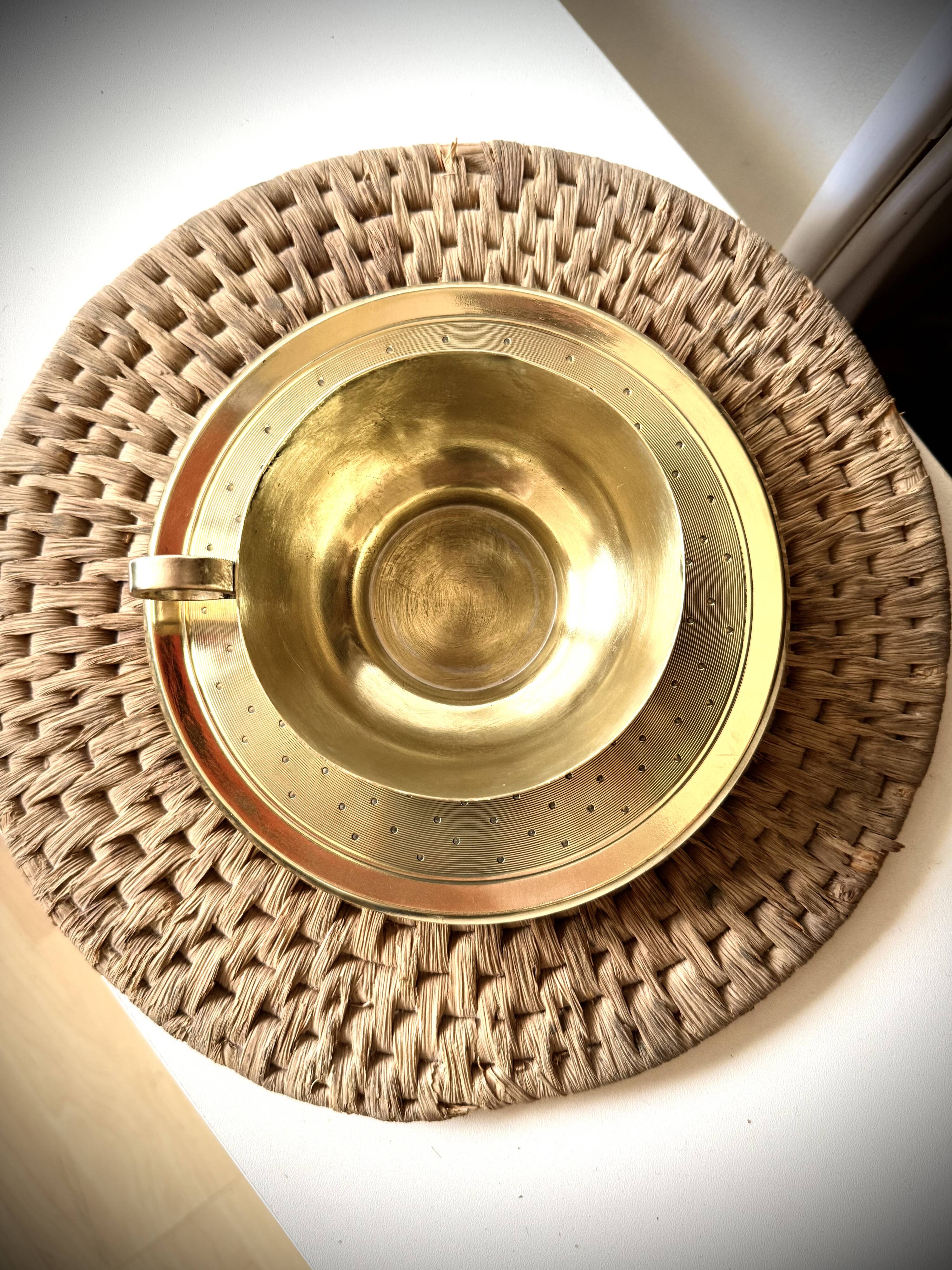 Cup and saucer in brass Saint Médard (18th century)