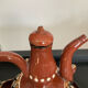 Vintage liqueur service in glazed terracotta