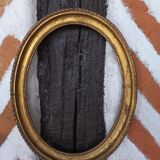Golden oval frame