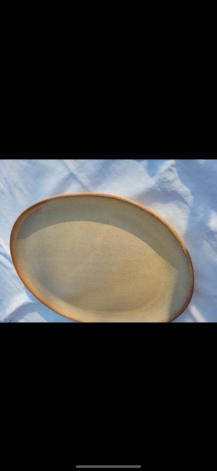 Oval dish in speckled enamelled stoneware