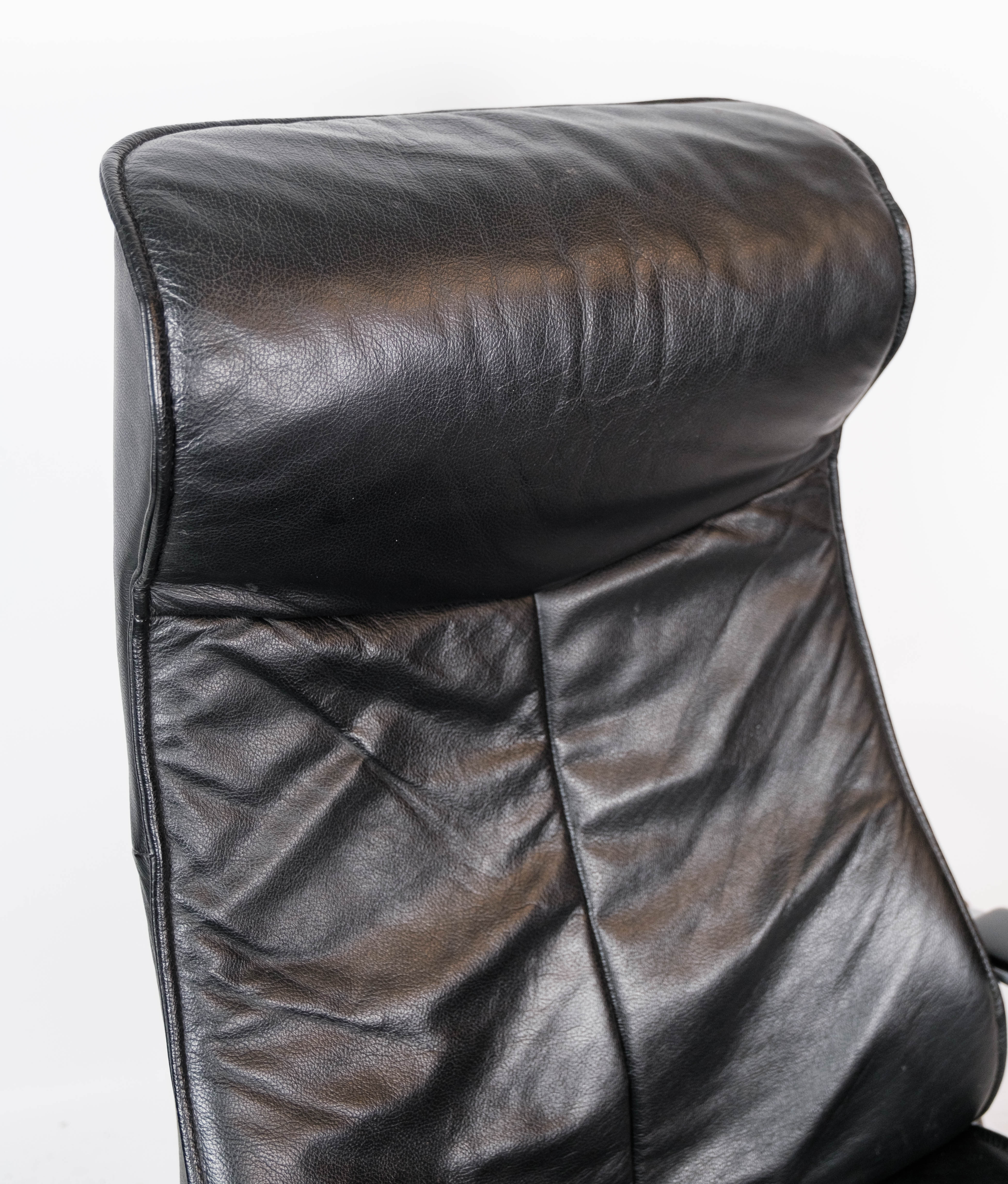 Easy chair with stool upholstered with black leather of Danish design, 1970s