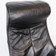 Easy chair with stool upholstered with black leather of Danish design, 1970s
