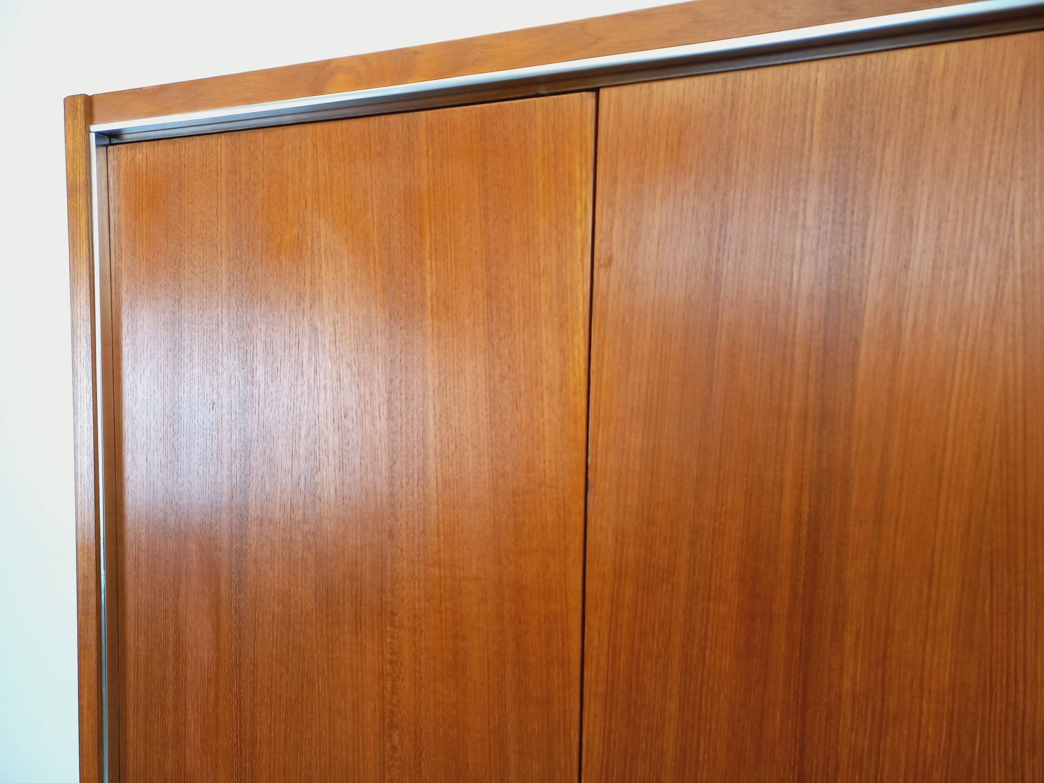 Vintage Scandinavian modernist wardrobe in teak and metal from the 1960s.