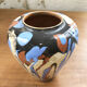Vase dripping in varnished earth